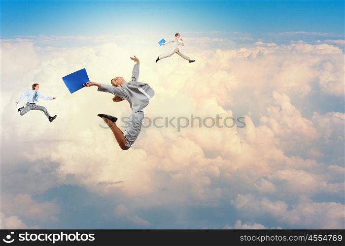Successful business people. Image of happy business people jumping high in sky