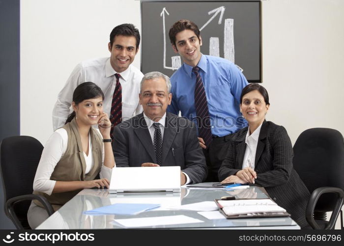 Successful business people smiling with confidence