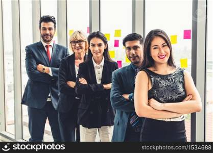 Successful business people standing together showing strong relationship of worker community. A team of businessman and businesswoman expressing a strong group teamwork at the modern office.