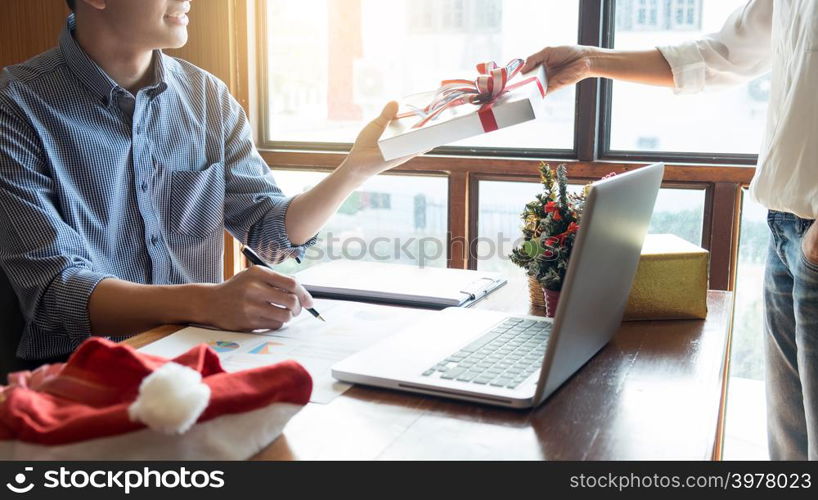 successful Business people wearing Santa hat celebrating 2019 New Year Christmas presents at office party, having great time