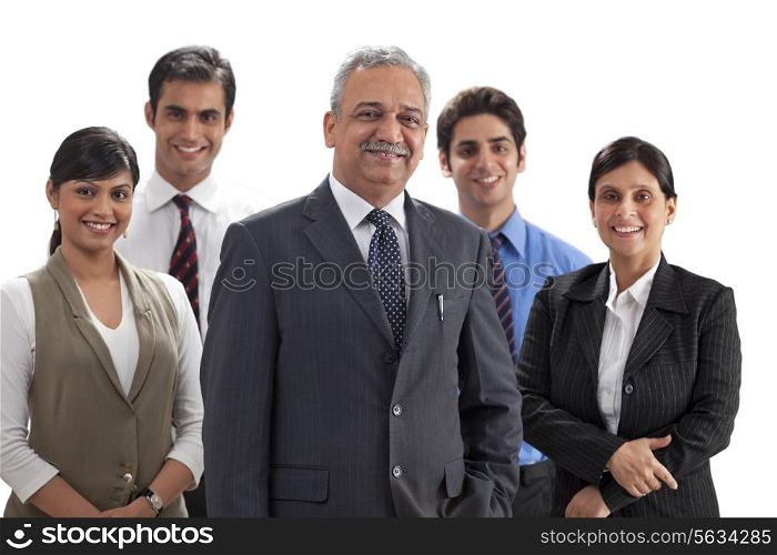 Successful business team smiling together on white background