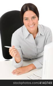 Successful business woman at office smiling sitting table hold pen