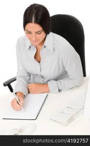 Successful business woman at office thinking sitting table write notepad