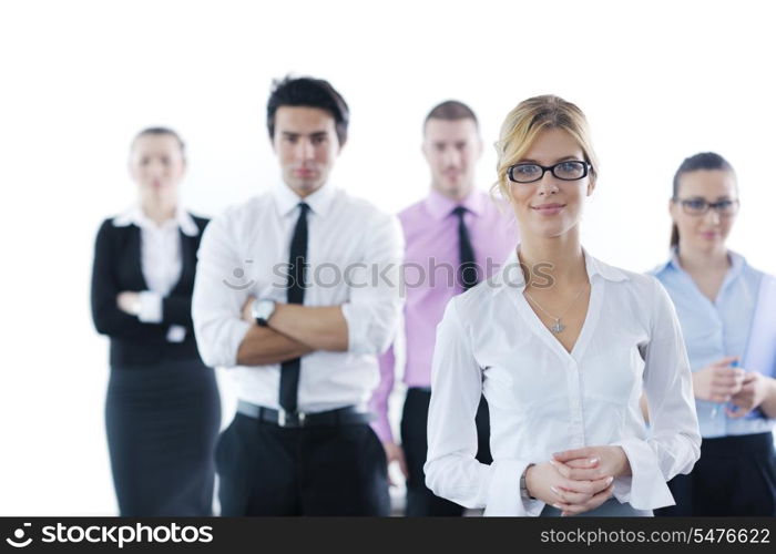 Successful business woman standing with her staff in background at modern bright office