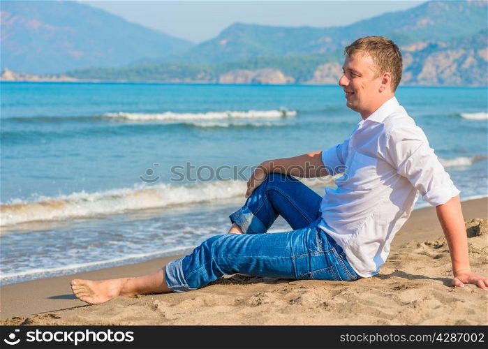 successful businessman free vacation by the sea