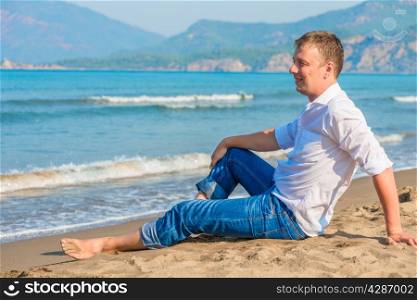 successful businessman free vacation by the sea