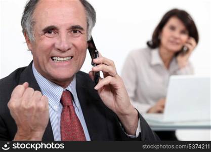 Successful businessman on phone