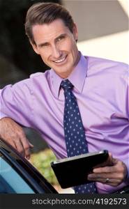 Successful Businessman Using Tablet Computer or iPad
