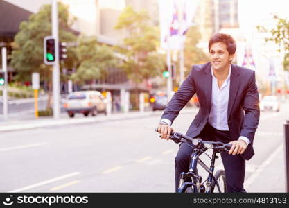 Successful businessman with bicycle. Successful businessman in suit with bicycle in city