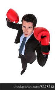 Successful businessman with boxing gloves
