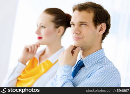 Successful businesspeople. Image of businessman and businesswoman smiling joyfully