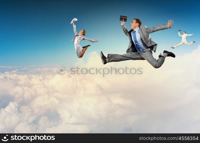 Successful businesspeople. Image of businesspeople jumping high in sky