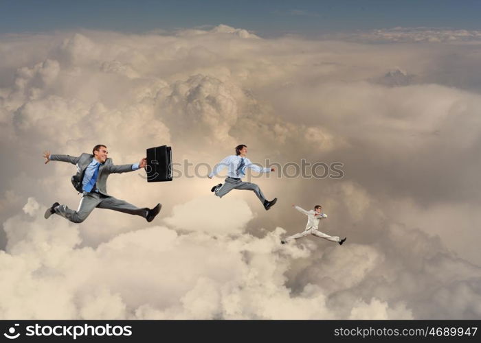 Successful businesspeople. Image of businesspeople jumping high in sky