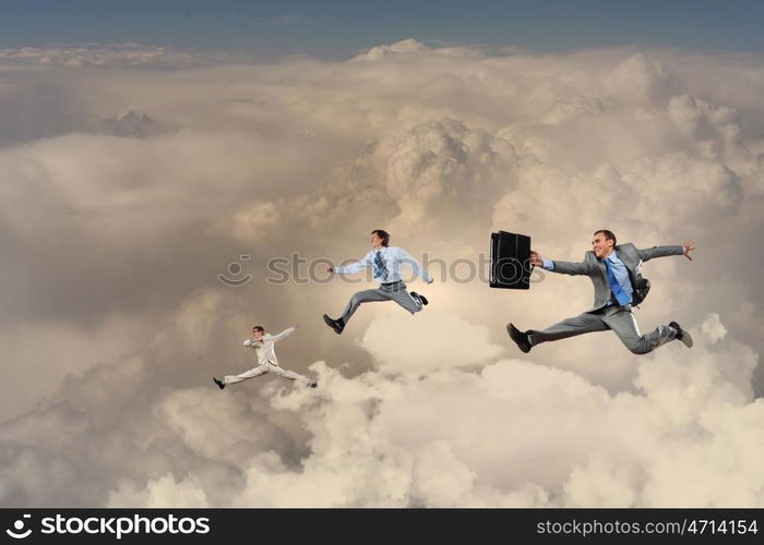 Successful businesspeople. Image of businesspeople jumping high in sky