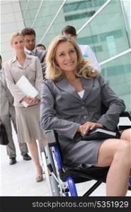 Successful businesswoman in wheelchair