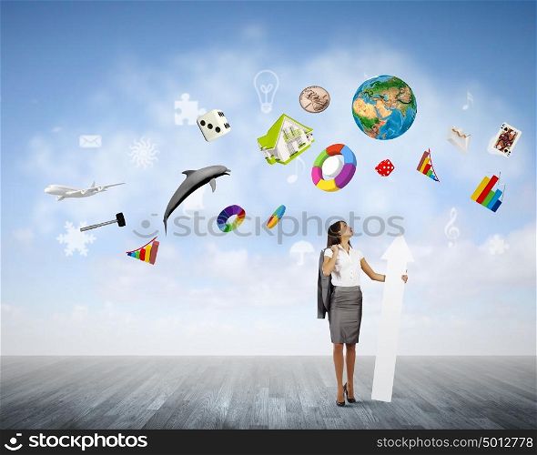 Successful businesswoman. Young businesswoman in suit with increasing arrow in hand. Elements of this image are furnished by NASA