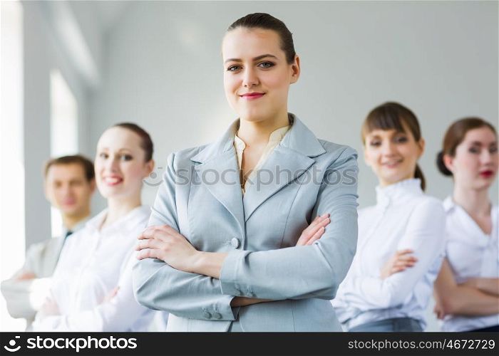 Successful businesswoman. Young smiling businesswoman with colleagues. Leadership concept