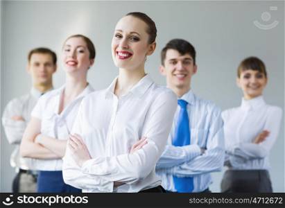 Successful businesswoman. Young smiling businesswoman with colleagues. Leadership concept