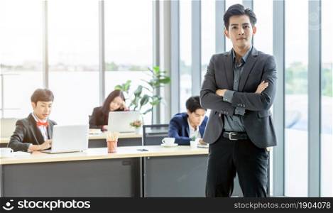 Successful company,executive Young Asian businessman partners with happy workers Group of asian business people with diverse genders (LGBT) in the meeting room at office