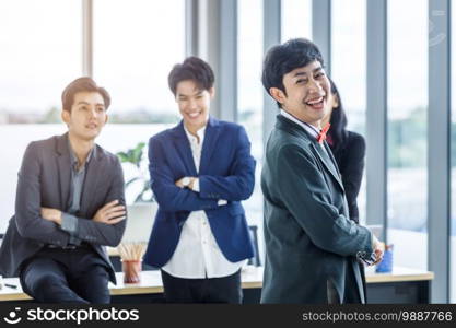 Successful company,executive Young Asian Homosexual businessman LGBT partners with happy workers Group of asian business people with diverse genders  LGBT  in the meeting room at office