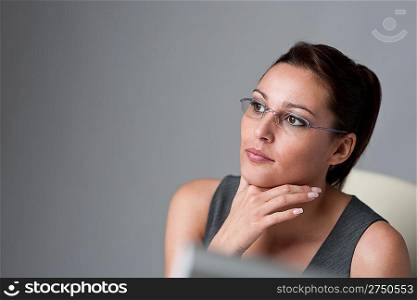 Successful executive businesswoman thinking at office