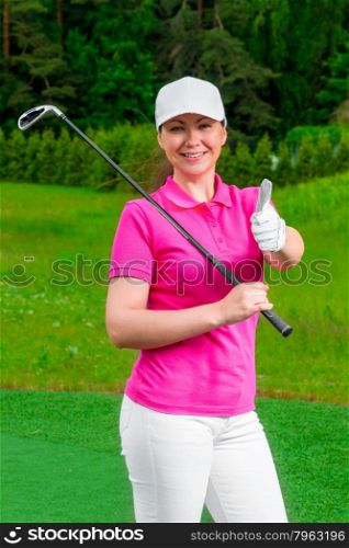 successful golfer happy woman standing with a golf club