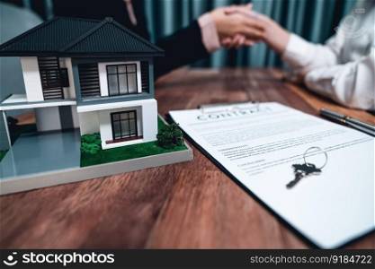 Successful house loan agreement sealed with a handshake. Buyers and agents celebrate the home ownership of property with a sense of accomplishment and satisfaction. Enthusiastic. Successful house loan agreement sealed with a handshake. Enthusiastic
