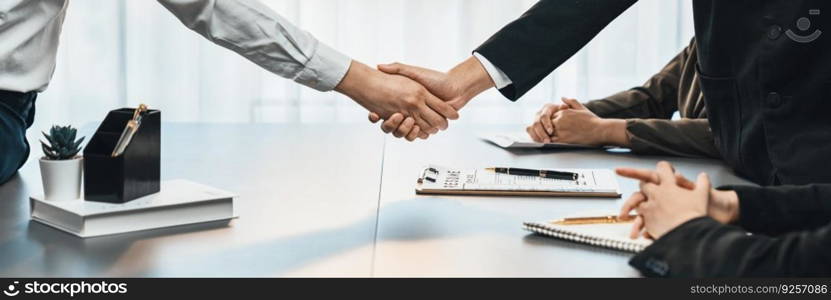 Successful job interview at business office end with handshake as the hired candidate seals the deal with the HR team recruiter by handshaking after successful interview. Panorama shot. Prodigy. Successful job interview at business office end with handshake. Prodigy