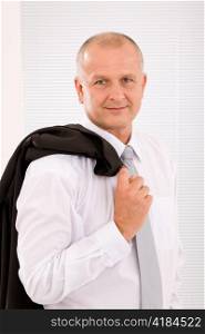 Successful mature businessman professional portrait jacket over shoulder