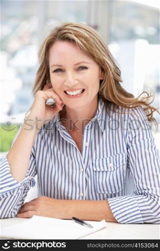 Successful mid age businesswoman on phone