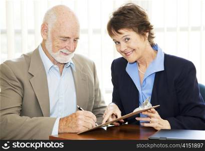 Successful saleswoman signs up a new client.