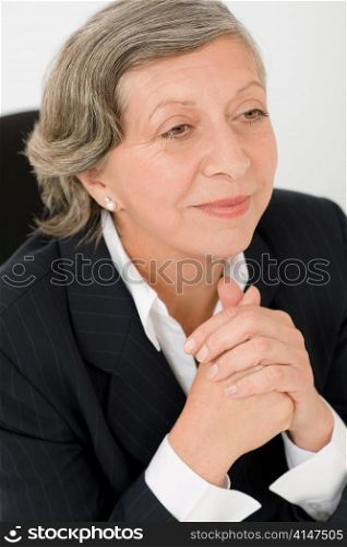 Successful senior businesswoman professional portrait looking aside
