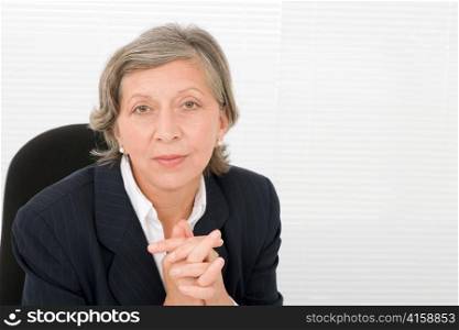 Successful senior businesswoman professional portrait watch camera