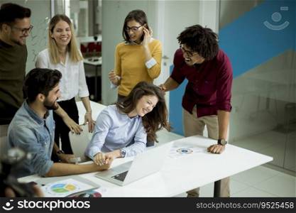 Successful young businesspeople having meeting in modern office space
