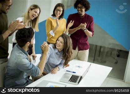 Successful young businesspeople having meeting in modern office space