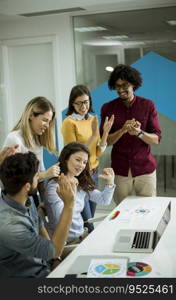 Successful young businesspeople having meeting in modern office space