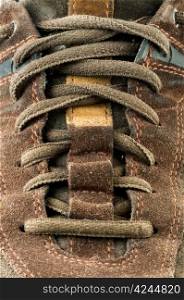 Suede shoe close up. Cross shoelaces