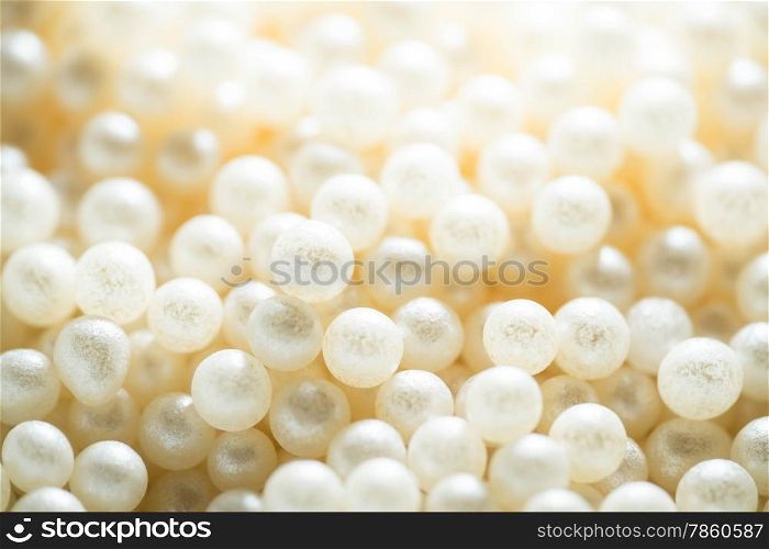 Sugar cake decorating pearls in a cream colour