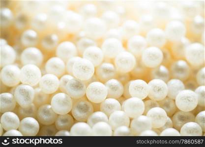 Sugar cake decorating pearls in a cream colour