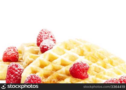 sugar covered raspberries on waffles with syrup. sugar covered raspberries on waffles with syrup on white background
