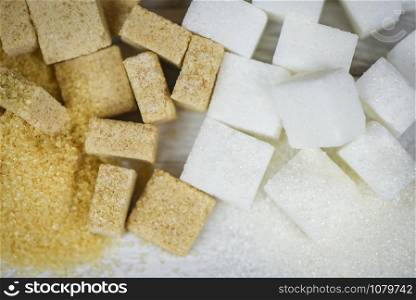sugar cubes background / white and brown sugar , top view