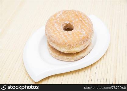 sugar donuts on a wooden background