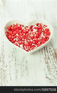 Sugar hearts in the plate - Valentine cake decorations. Valentine cake decorations