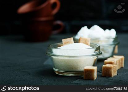 sugar in bowl and on a table