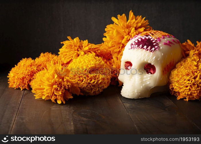 Sugar skull with Cempasuchil flowers or Marigold. Decoration traditionally used in altars for the celebration of the day of the dead in Mexico