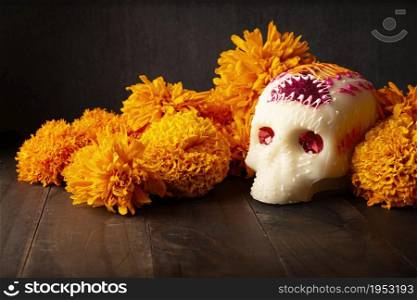 Sugar skull with Cempasuchil flowers or Marigold. Decoration traditionally used in altars for the celebration of the day of the dead in Mexico