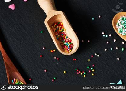 Sugar sprinkle dots on slate background