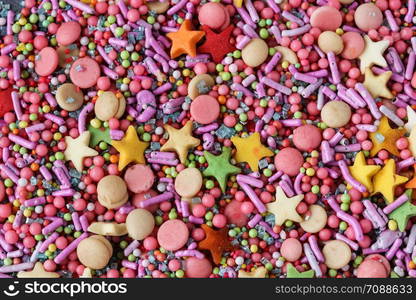 Sugar sprinkles on a grey background