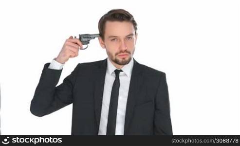 Suicidal businessman holding a gun to his head conceptual of stress at the office, financial crisis, failure and depression, isolated on white
