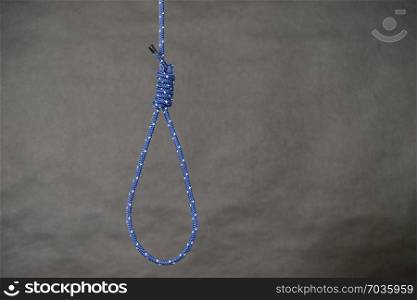 Suicide rope with knot on black background. Sorrow, psychological problems objects concept.. Suicide rope with knot on black background